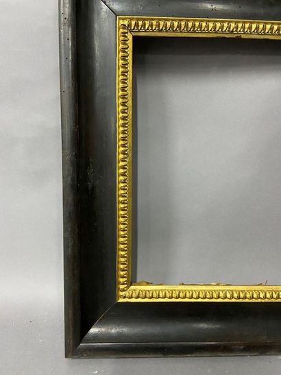 Blackened and moulded wooden frame with gold...
