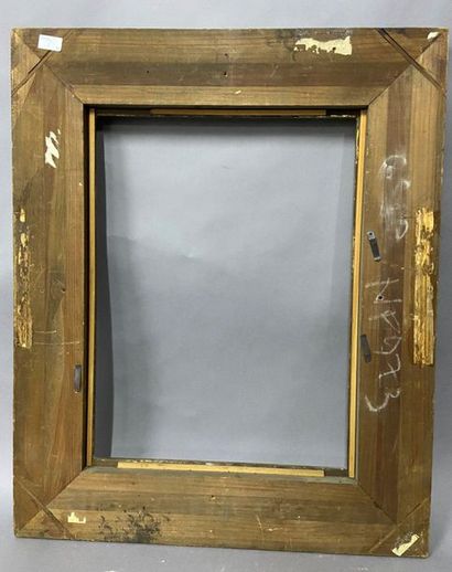 Moulded wooden frame with a patina and gilded...