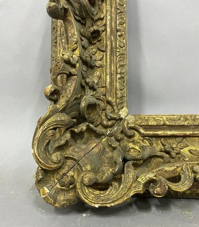 Carved and gilded wood frame with very rich...