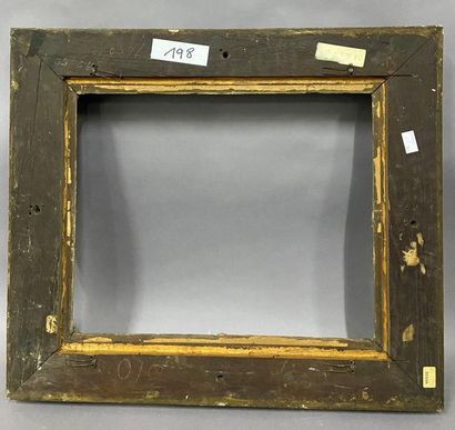 Carved and gilded wood frame with very rich...