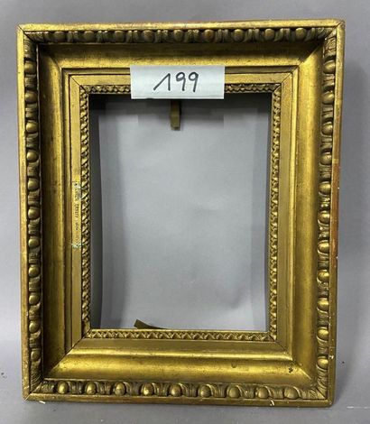 Carved and gilded wood frame with a frieze...