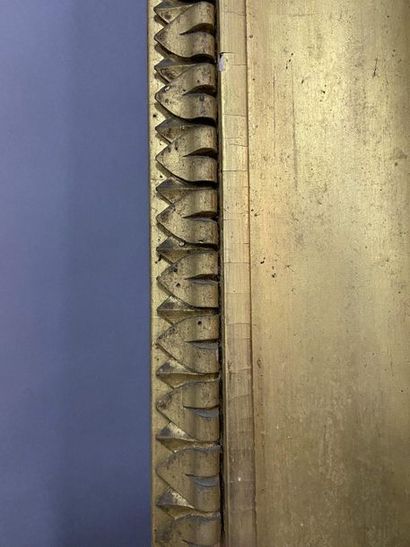 Carved and gilded wooden frame with a frieze...