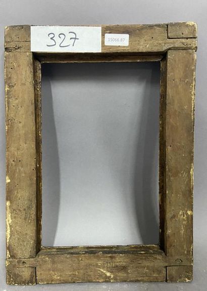 Cadre en bois sculpté et anciennement argenté...