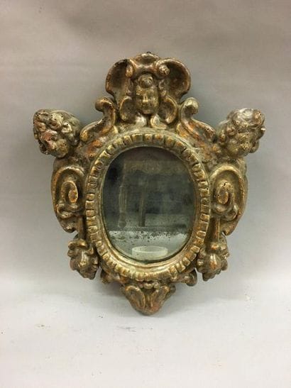 *Oval view frame in carved wood and silver...