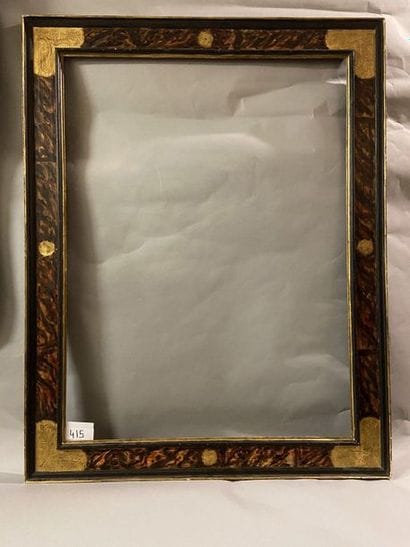 Large frame in patinated and gilded wood...