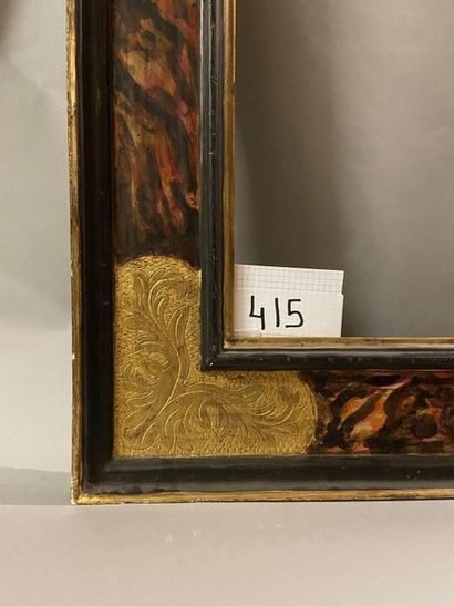 Large frame in patinated and gilded wood...