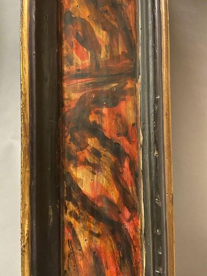 Large frame in patinated and gilded wood...