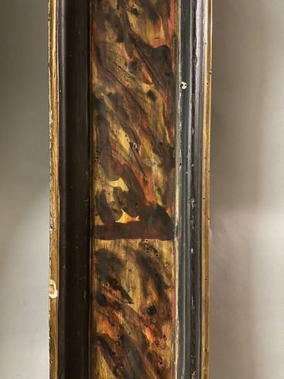 Large frame in patinated and gilded wood...