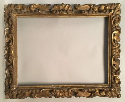 Carved and gilded wooden frame with openwork...