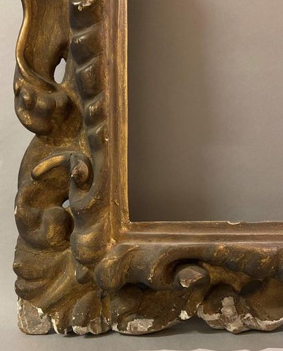 Carved and gilded wooden frame with openwork...