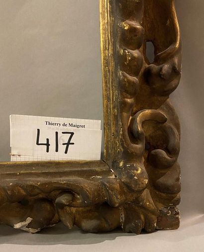 Carved and gilded wooden frame with openwork...