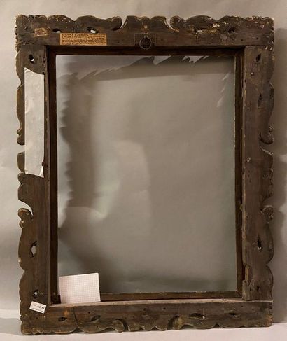Carved and gilded wooden frame with openwork...