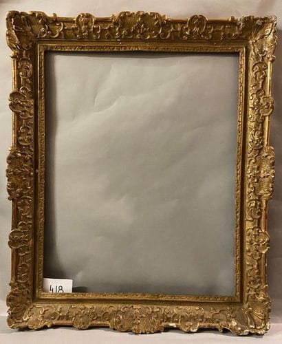 *Carved and gilded oak frame with Berain...