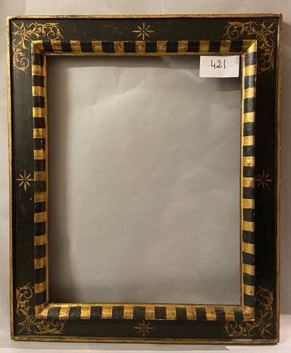 *Black and gold molded linden frame, called...