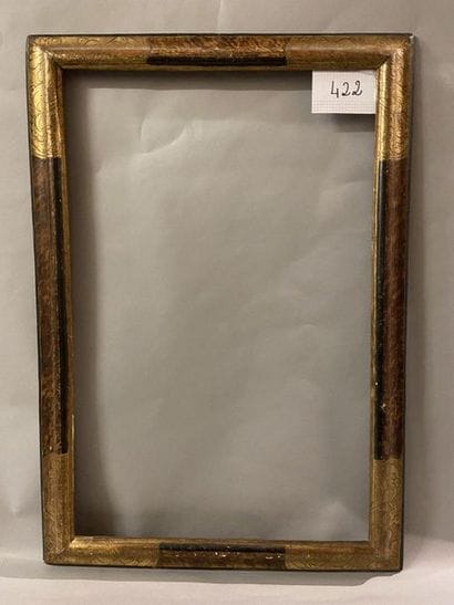 *Black and gold frame with upside down profile...