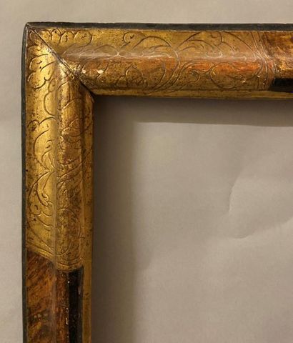 *Black and gold frame with upside down profile...