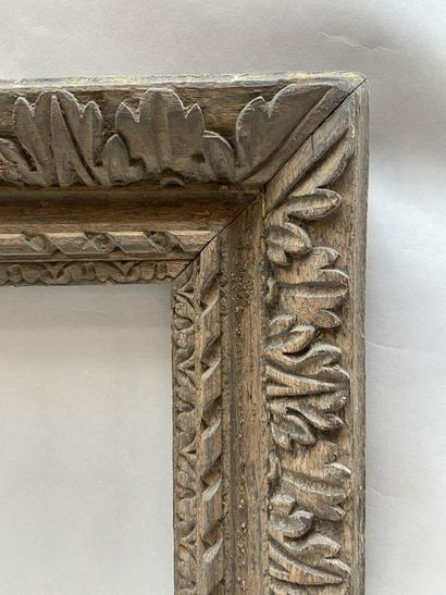 Carved natural oak frame with friezes, ribbons...