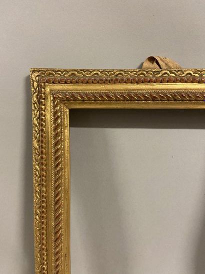 Pair of small carved and gilded oak frames...