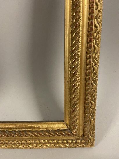 Pair of small carved and gilded oak frames...
