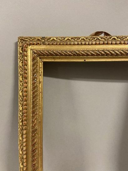 Pair of small carved and gilded oak frames...