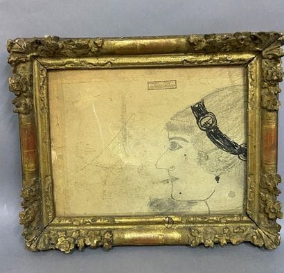 Cadre en chêne sculpté et doré à décor de...