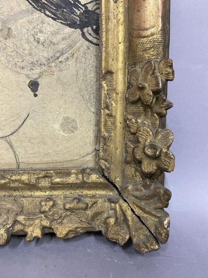 Cadre en chêne sculpté et doré à décor de...