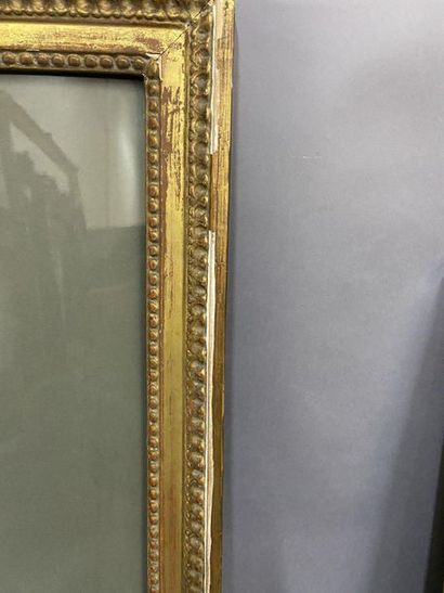 Grande baguette en bois sculpté et redoré...