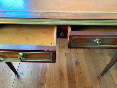 A Louis XVI style flat desk with two drawers,...