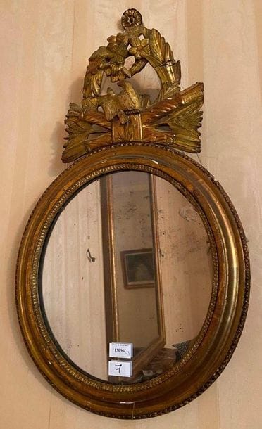 Oval mirror decorated with birds, quivers...