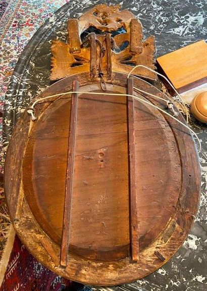 Oval mirror decorated with birds, quivers...