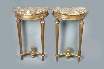 Pair of half-moon consoles in gilded wood
Spacers...