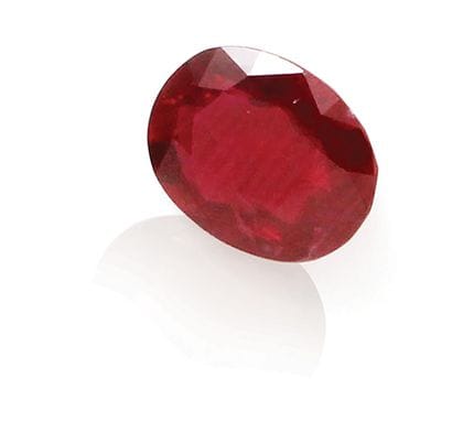 Oval faceted ruby on paper weighing 1.56...