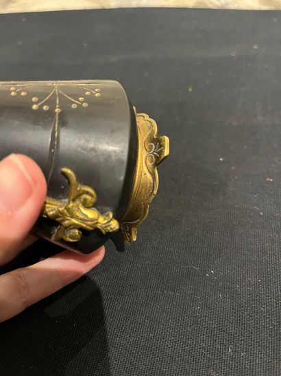 Black stone inkwell with ormolu frame, incised...