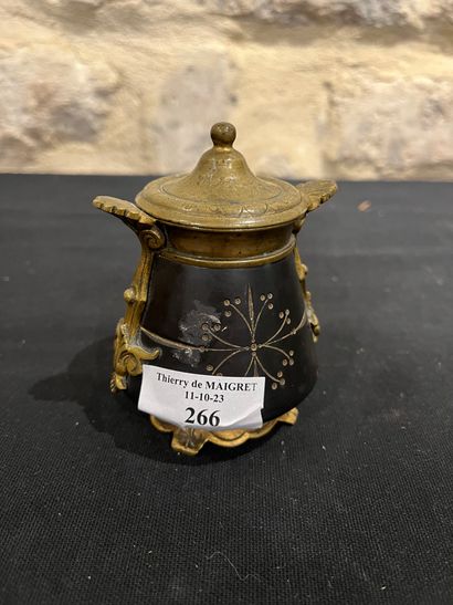 Black stone inkwell with ormolu frame, incised...