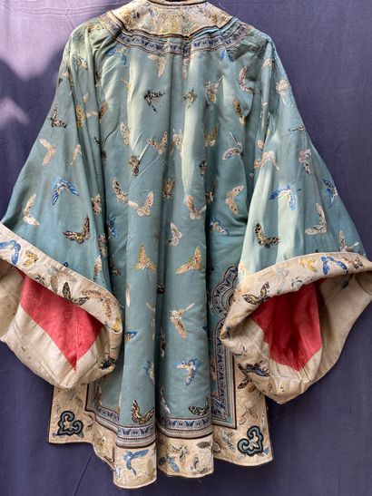 A Ladies' jacket in verdigris silk embroidered...