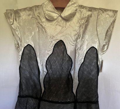 A Black silk and tulle ensemble with black...