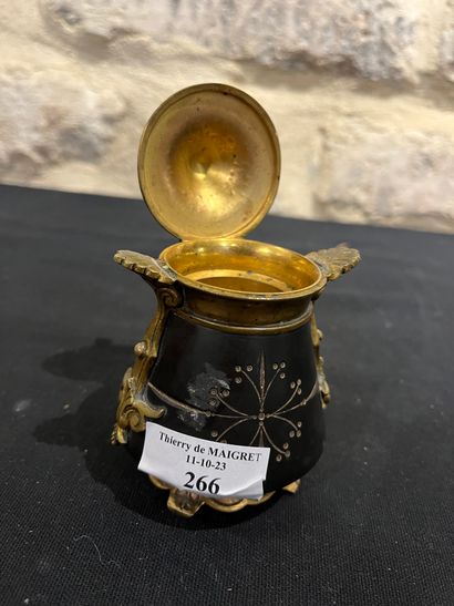 Black stone inkwell with ormolu frame, incised...