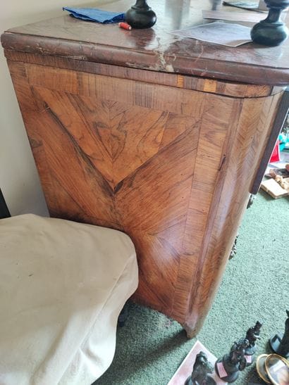 Rosewood veneered chest of drawers opening...