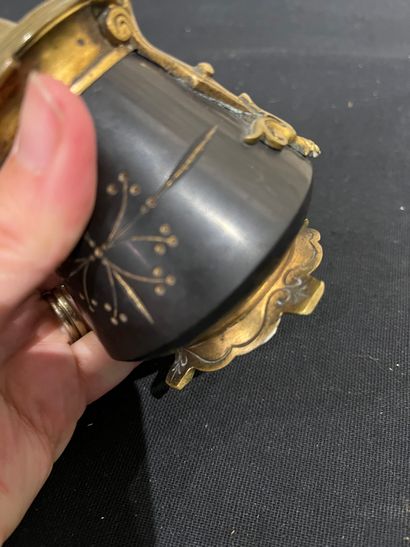Black stone inkwell with ormolu frame, incised...