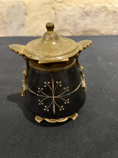 Black stone inkwell with ormolu frame, incised...