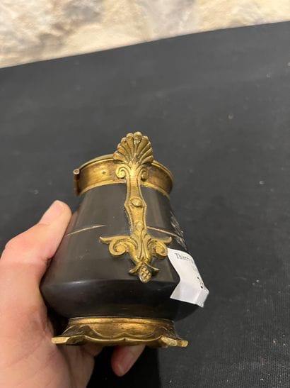 Black stone inkwell with ormolu frame, incised...