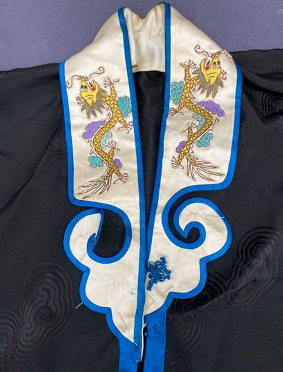 Black fabric jacket with blue piping, long...