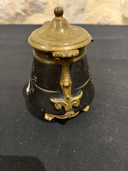 Black stone inkwell with ormolu frame, incised...