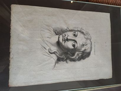 Lot de cinq encadrés représentant des visages...