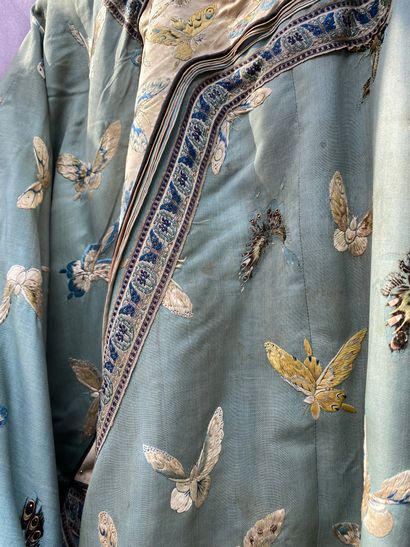 A Ladies' jacket in verdigris silk embroidered...