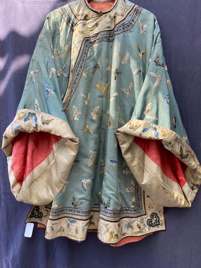 A Ladies' jacket in verdigris silk embroidered...