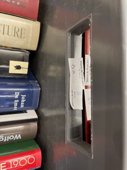 Two cases of art volumes including Charles...