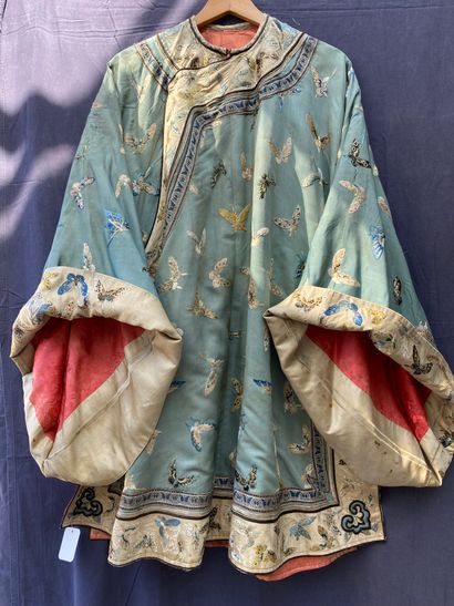 A Ladies' jacket in verdigris silk embroidered...