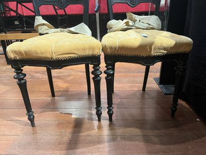 Turned wood cabinet legs and metal braces....