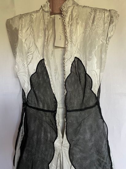 A Black silk and tulle ensemble with black...